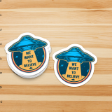 3 Inch Die Cut Sticker Photo shows 2 stickers that say "we want to believe" with an alien ship