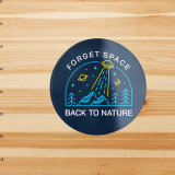4 Inch Round Stickers - Navy blue round sticker with an illustration of mountains with UFO's flying over head that Says "forget space, back to nature"