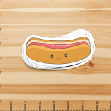 2x5 Inch Die Cut Sticker The image is a cute hotdog with a smiley face on the bun.